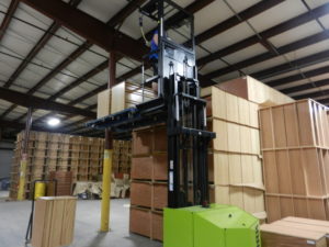 warehouse with forklift lifting boxes