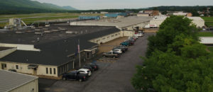 image of building with parking lot and trees in Williamsport