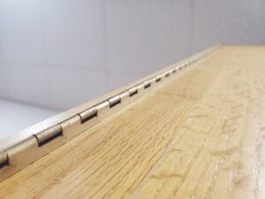 piano hinge connected to door